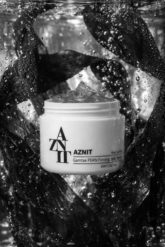 AZNIT serum jar among Gamtae seaweed, black and white photograph